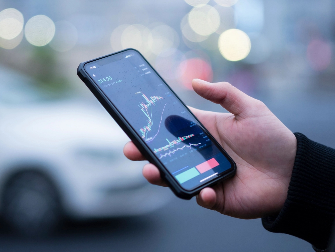 hand holding a phone with data on the phone screen